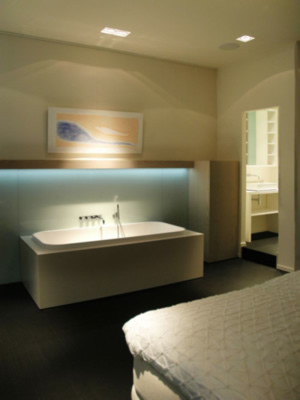 The second floor has a bedroom with integrated bathroom.