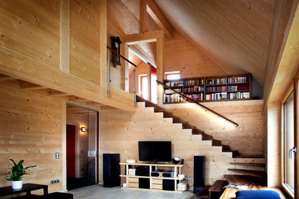 The living space is spread over two floors, and the staircase is elegantly integrated in the architecture. 