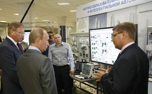 Vladimir Putin at the Smart City with MSUCE Rector Professor Valery Telichenko (left), yours truly (centre) and Professor Andrey Volkov (right).