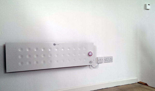 One of four electric panel heaters that had already been installed in the building.