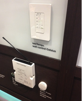 Thermostat, temperature sensor and HVAC controller on the Lutron stand.