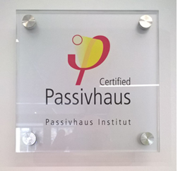 The plaque certifying the Centre for Medicine's Passivhaus status, located in the atrium of the building.