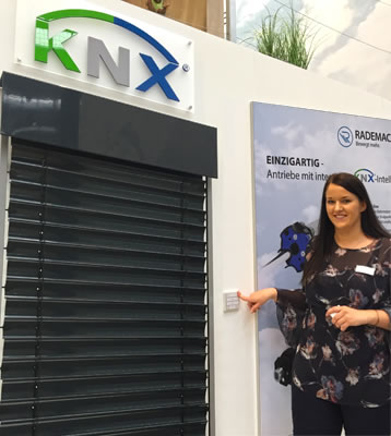 Rademacher Export and Sales Manager, Lisa Elsinghorst, demonstrating the Rollotube X-line of KNX motors with built-in actuator.