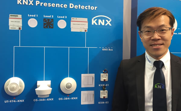 Ethan Lin of Aurex showing the company's different types of light and motion sensor.