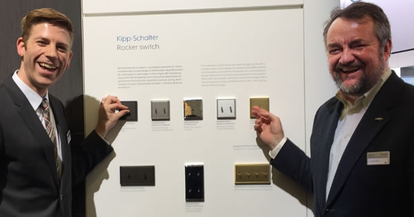 Jung's Björn Schulte (left) and Graham Oliver (right) demonstrating the new LS 1912 rocker switches in one-, two- and four-gang models.