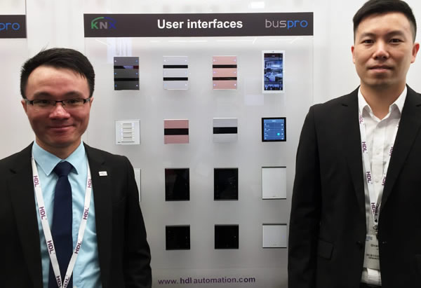 (L-to-R) HDL Marketing Director, Ben Young, and Regional Sales Manager, Lawrence Jiang, alongside HDL's range of switches and touchpanels.